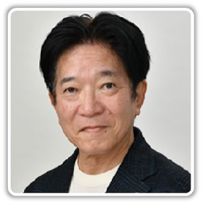 Portrait of a middle-aged East Asian man with short black hair, wearing a dark blazer and white shirt, looking at the camera.